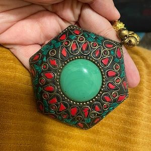 Pendant with beaded neckline